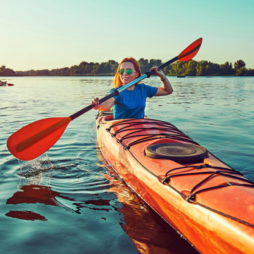 Woman in a kayak on the lake